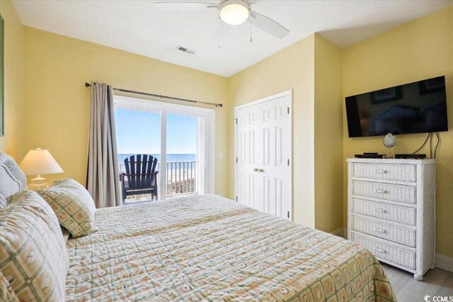 817 S Ocean Blvd Unit 105, North Myrtle Beach, SC 29582 - bedroom featuring access to outside, wood finished floors, and ceiling fan
