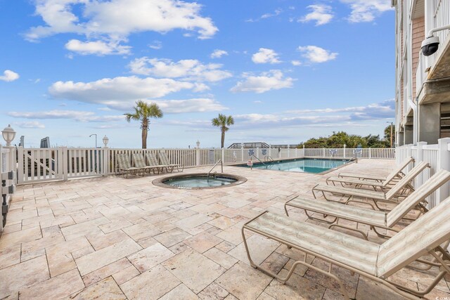 817 S Ocean Blvd Unit 105, North Myrtle Beach, SC 29582 - community pool featuring a hot tub and a patio