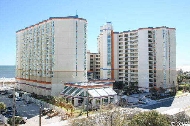 view of property with a view of city and a water view