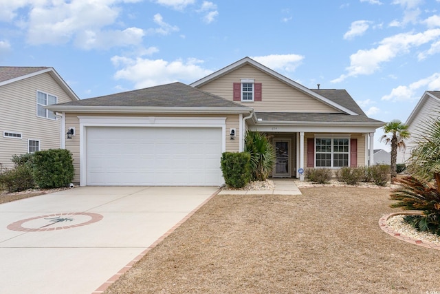 view of front of home with concrete driveway, a shingled roof, and an attached garage