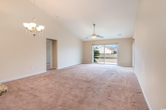 empty room with high vaulted ceiling, carpet, and baseboards