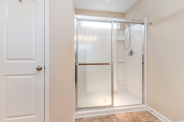 full bathroom with a shower with shower door