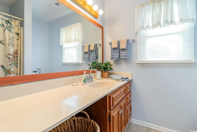 317 14th Ave N, Surfside Beach, SC 29575 - bathroom featuring vanity and tile patterned flooring