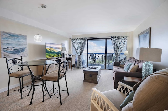 living room featuring light carpet and baseboards