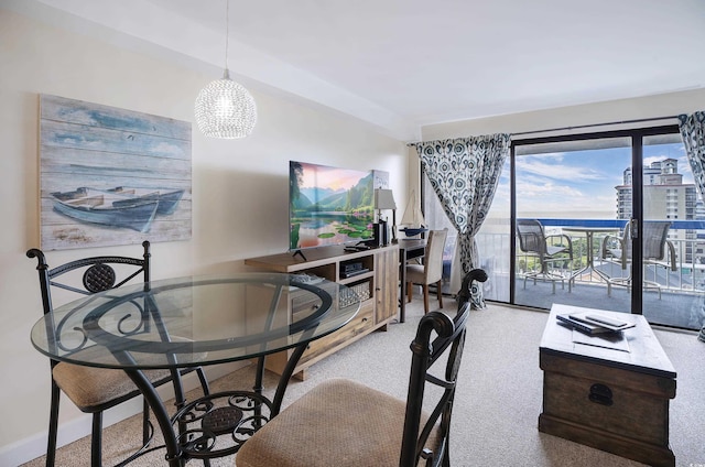 dining room with light carpet