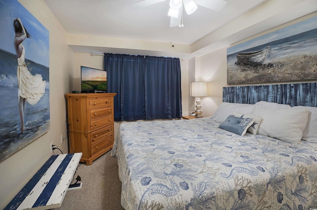 bedroom featuring dark carpet and a ceiling fan