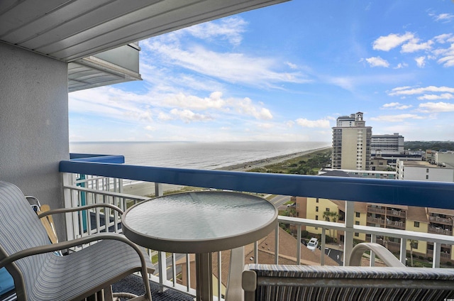 balcony with a water view and a city view