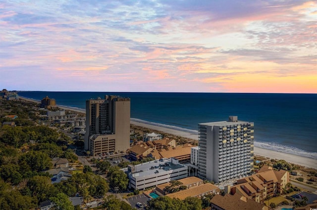 aerial view with a view of the beach, a water view, and a city view