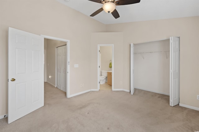 unfurnished bedroom with light carpet, a closet, ensuite bathroom, and baseboards