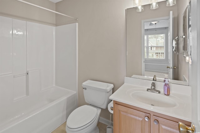 bathroom featuring shower / bathing tub combination, vanity, and toilet