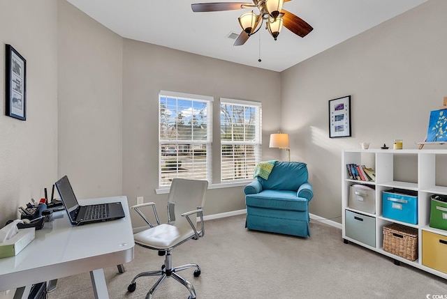 office with carpet, visible vents, ceiling fan, and baseboards