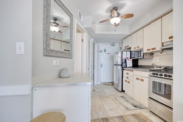 kitchen with visible vents, appliances with stainless steel finishes, white cabinetry, ceiling fan, and under cabinet range hood