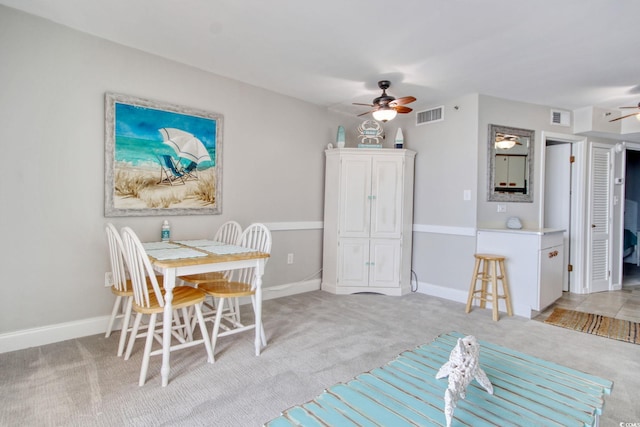 dining area with carpet, visible vents, ceiling fan, and baseboards