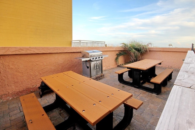 view of patio / terrace featuring grilling area and fence