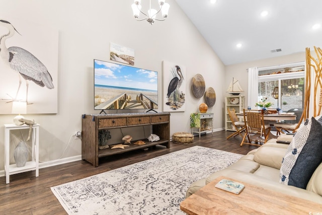 living area with dark wood-style floors, a chandelier, visible vents, and baseboards