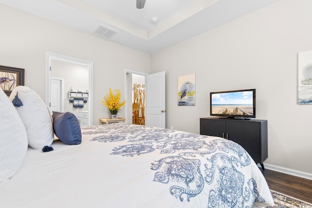 bedroom featuring baseboards, visible vents, a ceiling fan, connected bathroom, and dark wood-type flooring