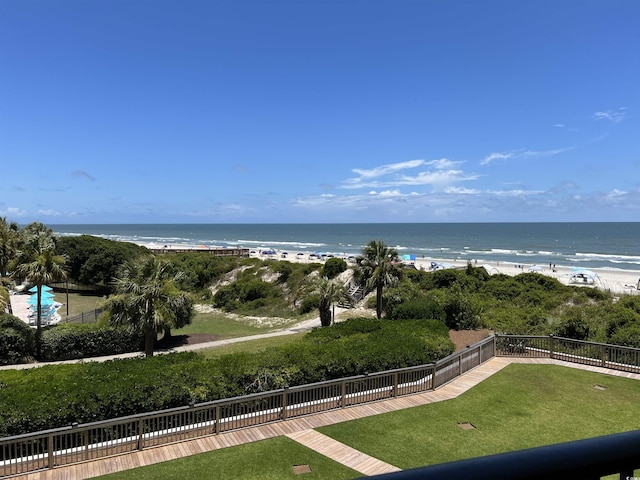 water view featuring a view of the beach and fence