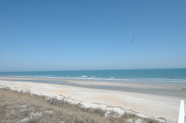 view of water feature with a beach view