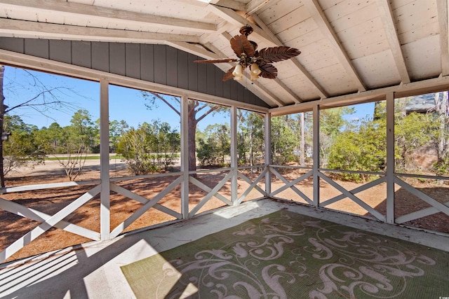 unfurnished sunroom with vaulted ceiling and ceiling fan