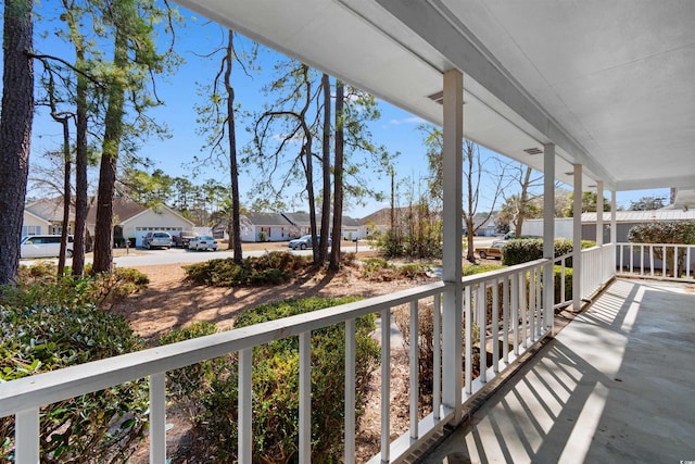 balcony featuring a residential view and covered porch