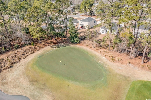 birds eye view of property with view of golf course