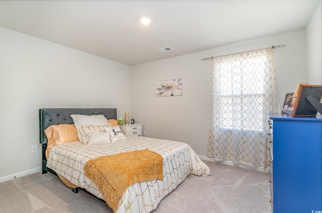 bedroom featuring baseboards, visible vents, and carpet flooring