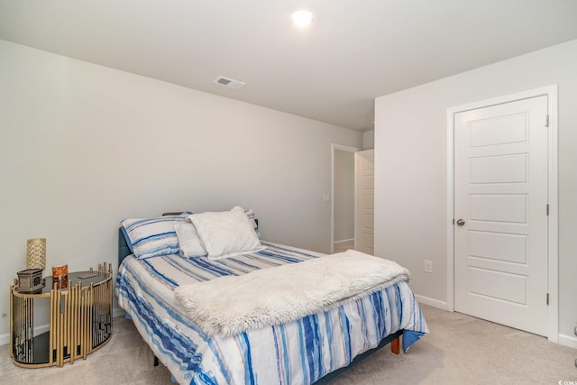 bedroom with carpet, visible vents, and baseboards