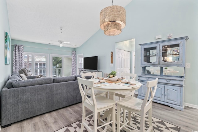 601 N Hillside Dr Unit 4632, North Myrtle Beach, SC 29582 - dining room with high vaulted ceiling, a ceiling fan, light wood-style flooring, and baseboards