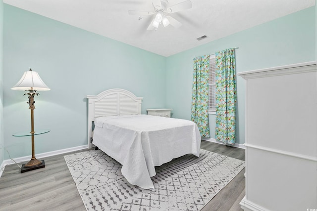601 N Hillside Dr Unit 4632, North Myrtle Beach, SC 29582 - bedroom with wood finished floors, baseboards, and a ceiling fan
