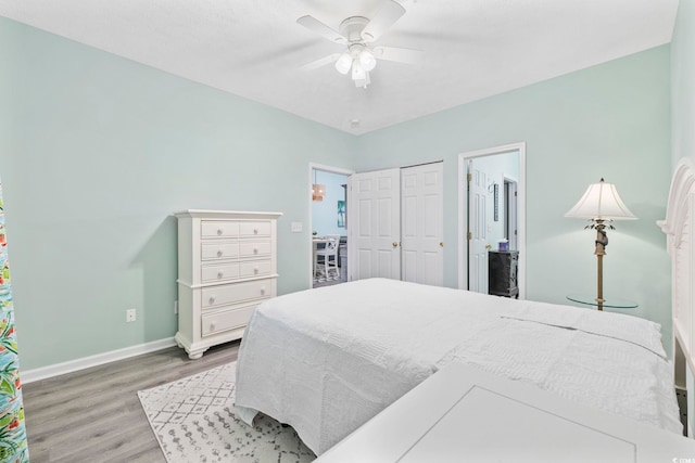 601 N Hillside Dr Unit 4632, North Myrtle Beach, SC 29582 - bedroom featuring wood finished floors, baseboards, ceiling fan, and ensuite bathroom