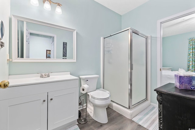 601 N Hillside Dr Unit 4632, North Myrtle Beach, SC 29582 - full bath featuring a stall shower, wood finished floors, toilet, vanity, and baseboards