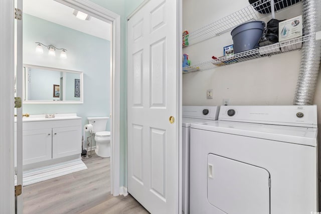 601 N Hillside Dr Unit 4632, North Myrtle Beach, SC 29582 - laundry area with washing machine and clothes dryer and light wood-style flooring