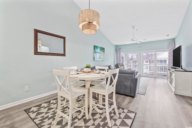 601 N Hillside Dr Unit 4632, North Myrtle Beach, SC 29582 - dining room featuring light wood-style floors, baseboards, a chandelier, ceiling fan, and high vaulted ceiling