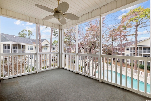601 N Hillside Dr Unit 4632, North Myrtle Beach, SC 29582 - unfurnished sunroom featuring a ceiling fan and a residential view