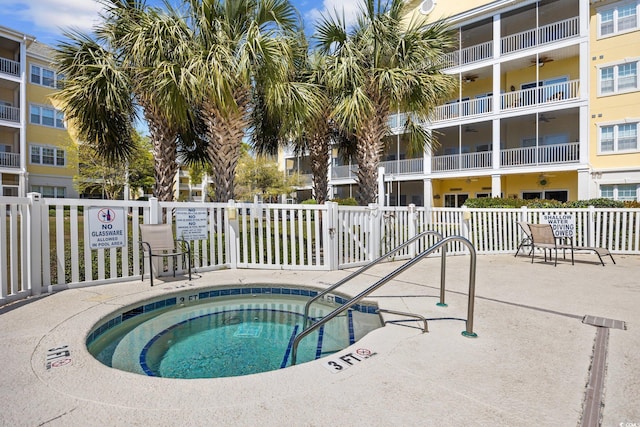 601 N Hillside Dr Unit 4632, North Myrtle Beach, SC 29582 - view of swimming pool featuring a community hot tub and fence