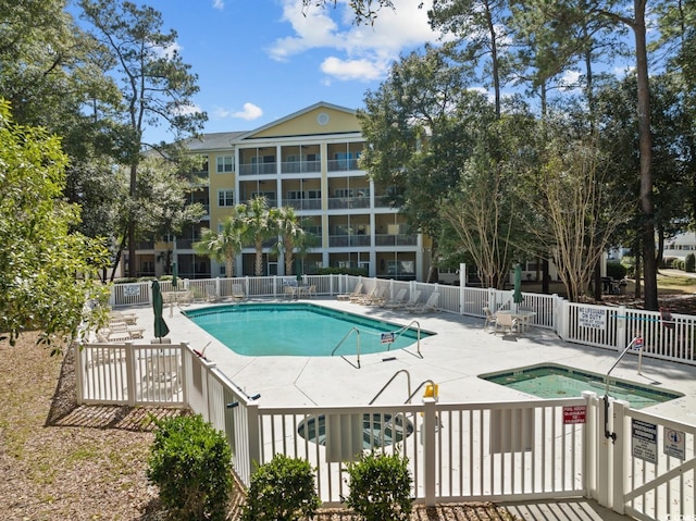 601 N Hillside Dr Unit 4632, North Myrtle Beach, SC 29582 - community pool featuring fence, a patio area, and a community hot tub