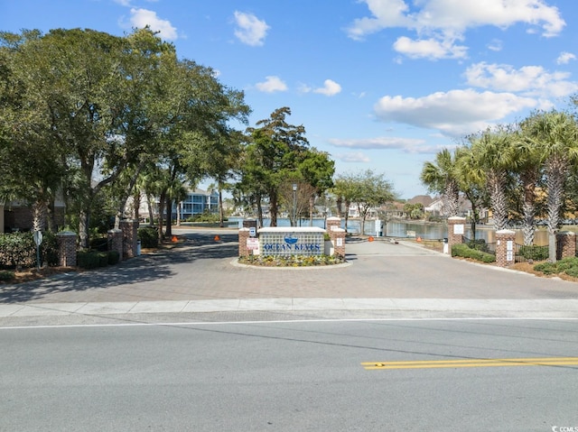 601 N Hillside Dr Unit 4632, North Myrtle Beach, SC 29582 - view of asphalt street with a residential view, curbs, and a gated entry