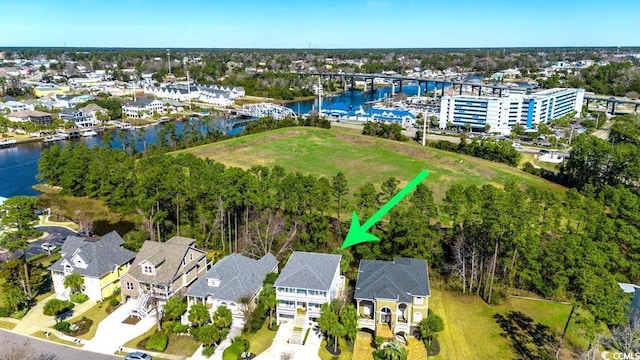 birds eye view of property featuring a water view