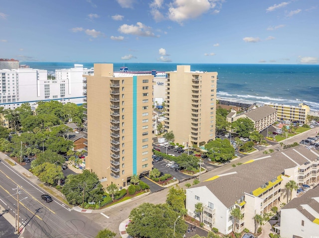 birds eye view of property featuring a water view and a view of the beach