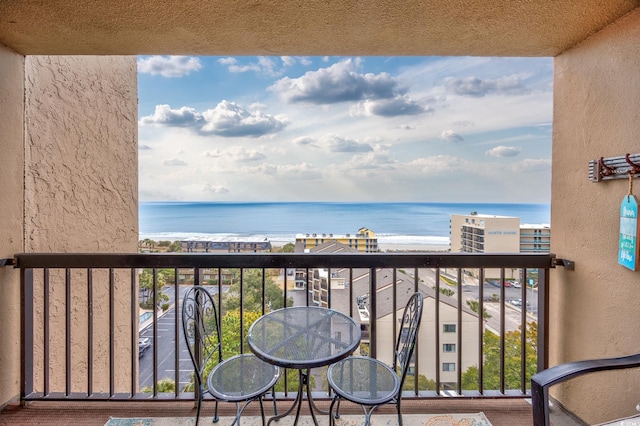 balcony featuring a water view