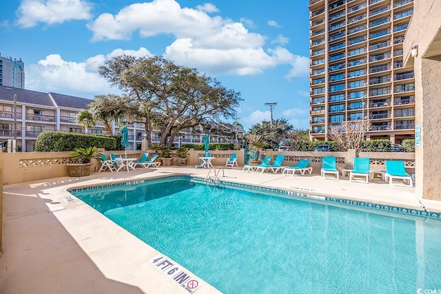 pool with a patio