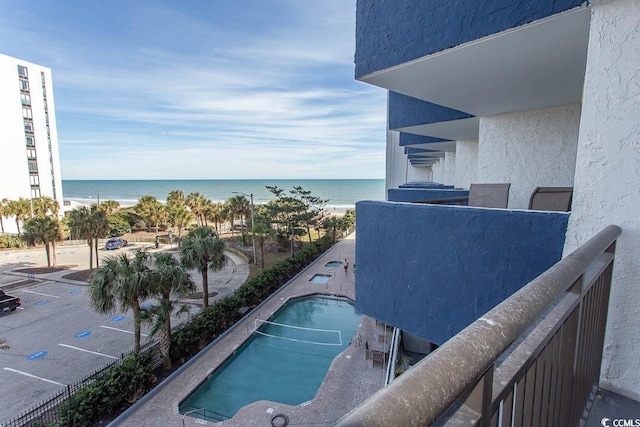 balcony featuring a water view