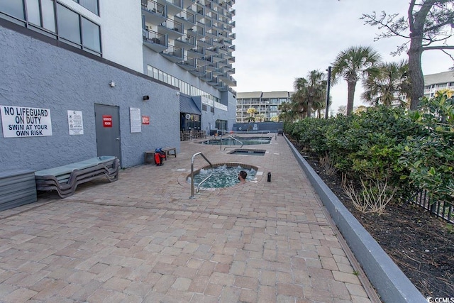 view of property's community featuring a patio area