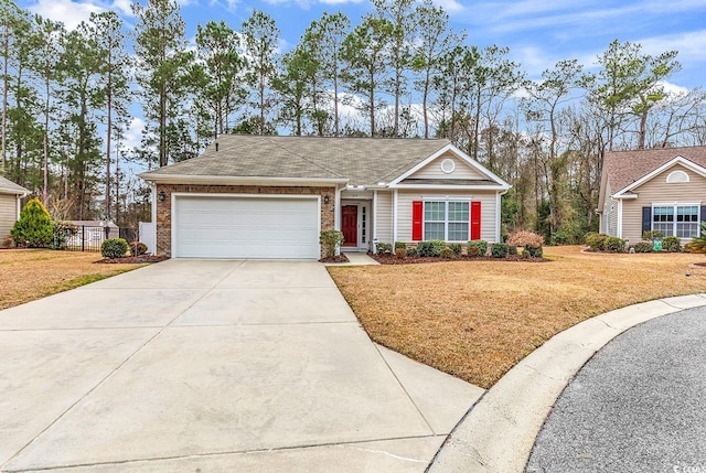 single story home featuring an attached garage, brick siding, concrete driveway, and a front yard