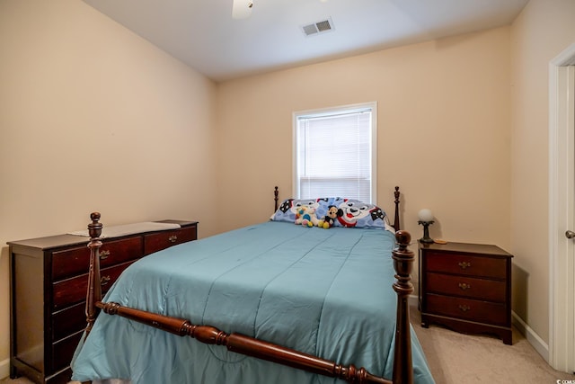 bedroom featuring light carpet, visible vents, and baseboards