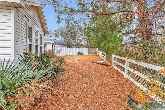 view of yard with fence