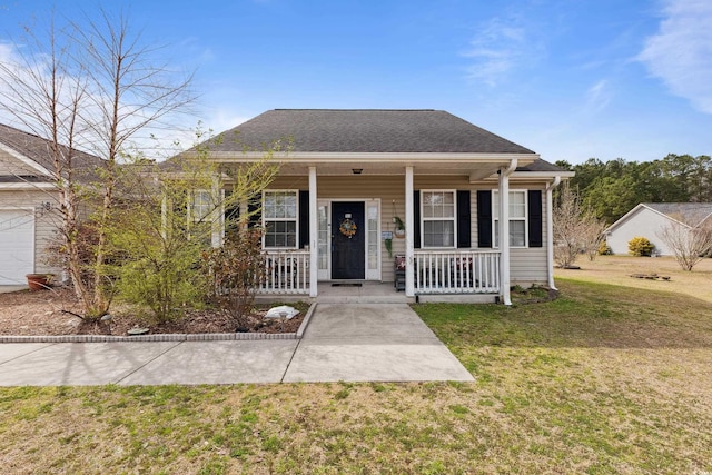 bungalow-style house with a porch, a shingled roof, and a front lawn