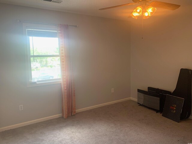 4584 Lomax Ct Unit 1B, Murrells Inlet, SC 29576 - empty room with carpet floors, visible vents, baseboards, and ceiling fan