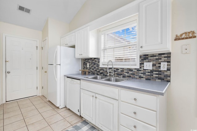 kitchen with white dishwasher, a sink, visible vents, white cabinetry, and light countertops