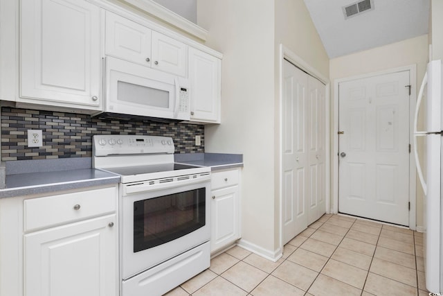 kitchen featuring light tile patterned floors, white appliances, visible vents, and white cabinets